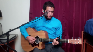 Edgar Aguilar playing his guitar 